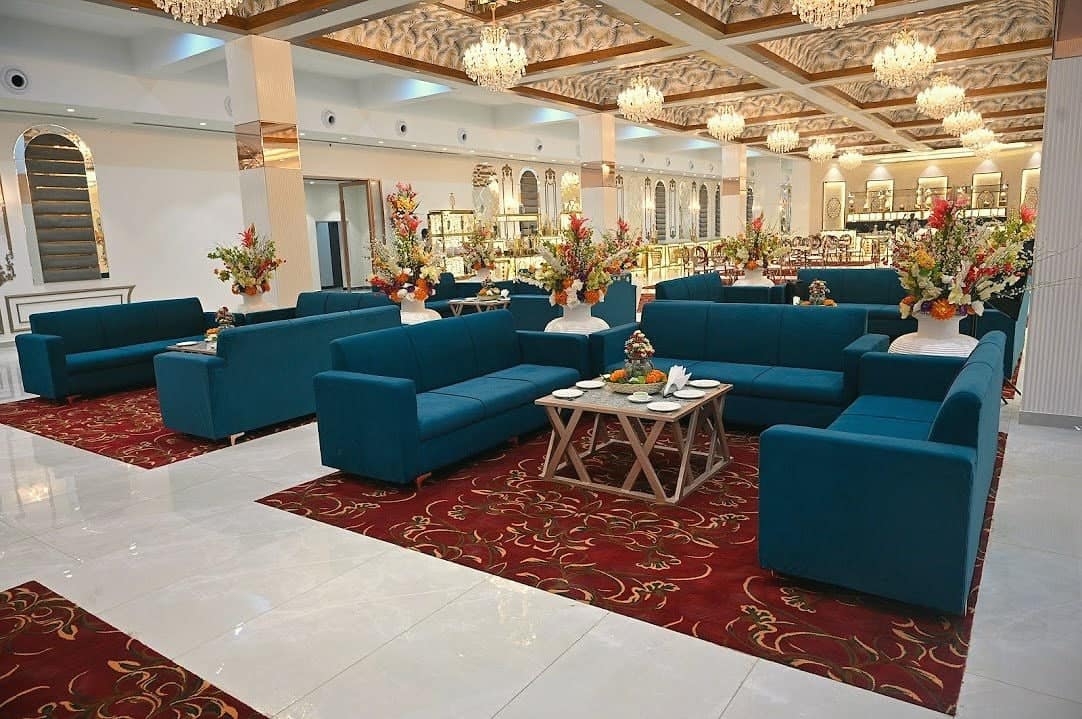 Seating clusters under chandeliers inside the banquet hall