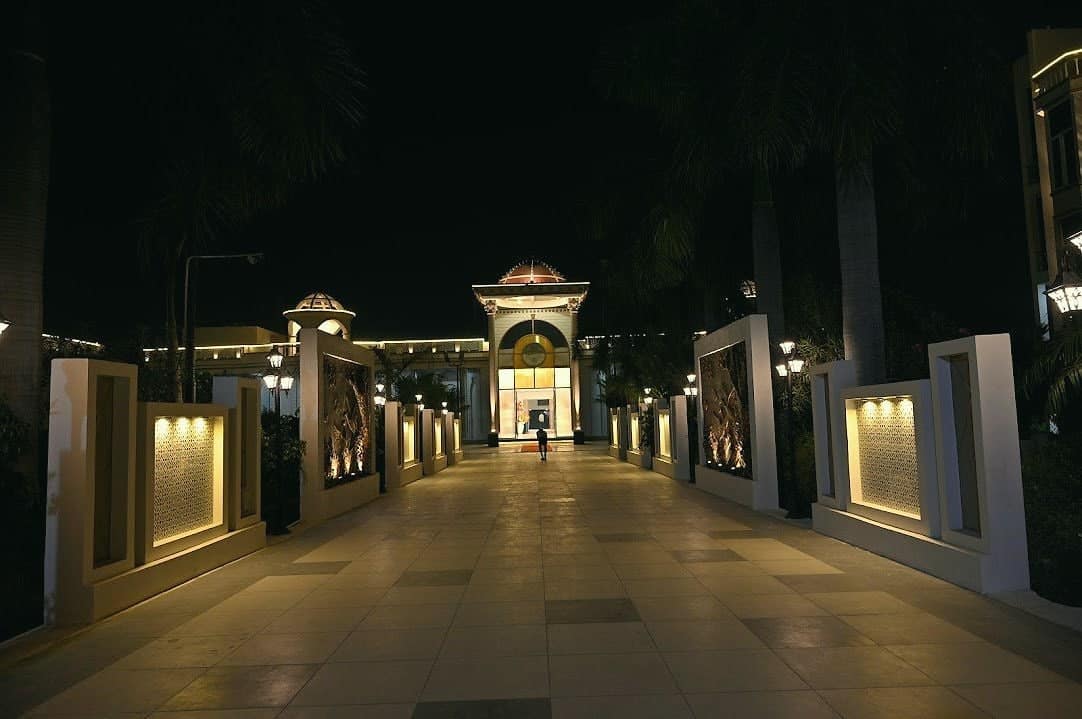 The lit driveway leading to the hotel entrance