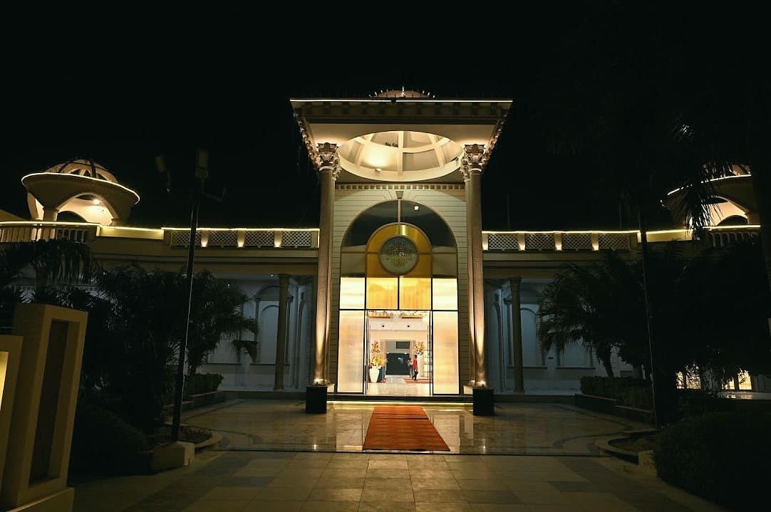 An arched entrance pavilion glowing at night